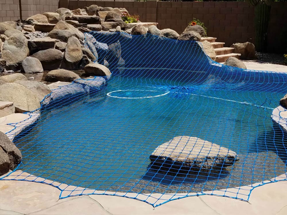 Swimming pool safety net installed for child and pet protection in home or resort