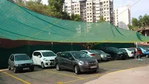 Car parking safety net installation to protect vehicles from debris and birds