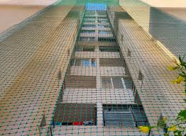 Construction safety nets installed on high-rise building site for worker protection